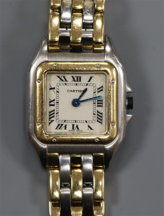 A ladys Cartier Panthere steel and gold quartz wrist watch, with Cartier pouch.